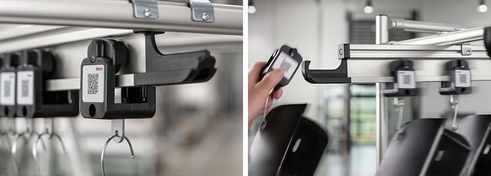 Item suspended conveyor system carriages slot easily onto the rail and have an end stop that acts as a back stop